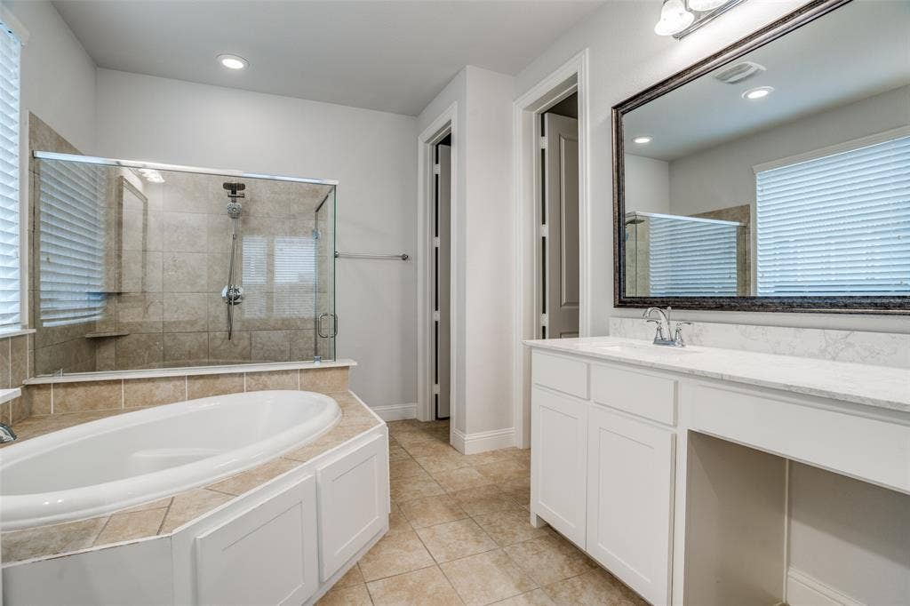 2811 Killdeer Trail, Prosper, TX 75078 Full bathroom with a bath, a stall shower, vanity, light tile patterned flooring, and recessed lighting