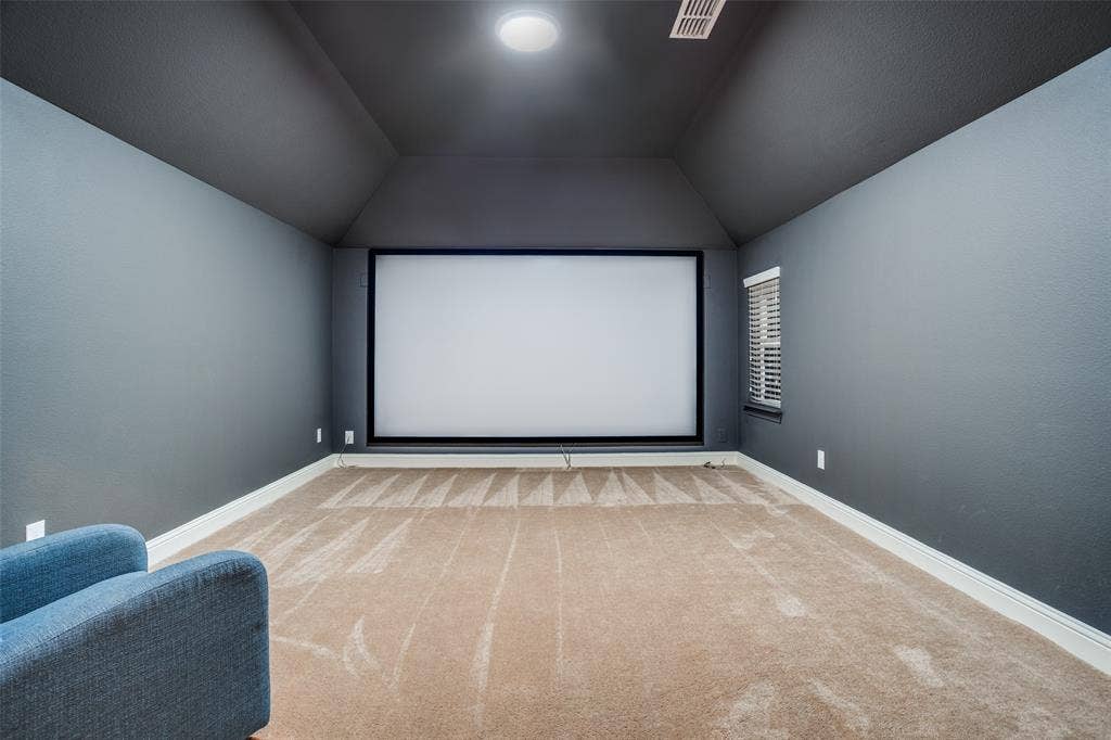 2811 Killdeer Trail, Prosper, TX 75078 Cinema room featuring carpet flooring and vaulted ceiling