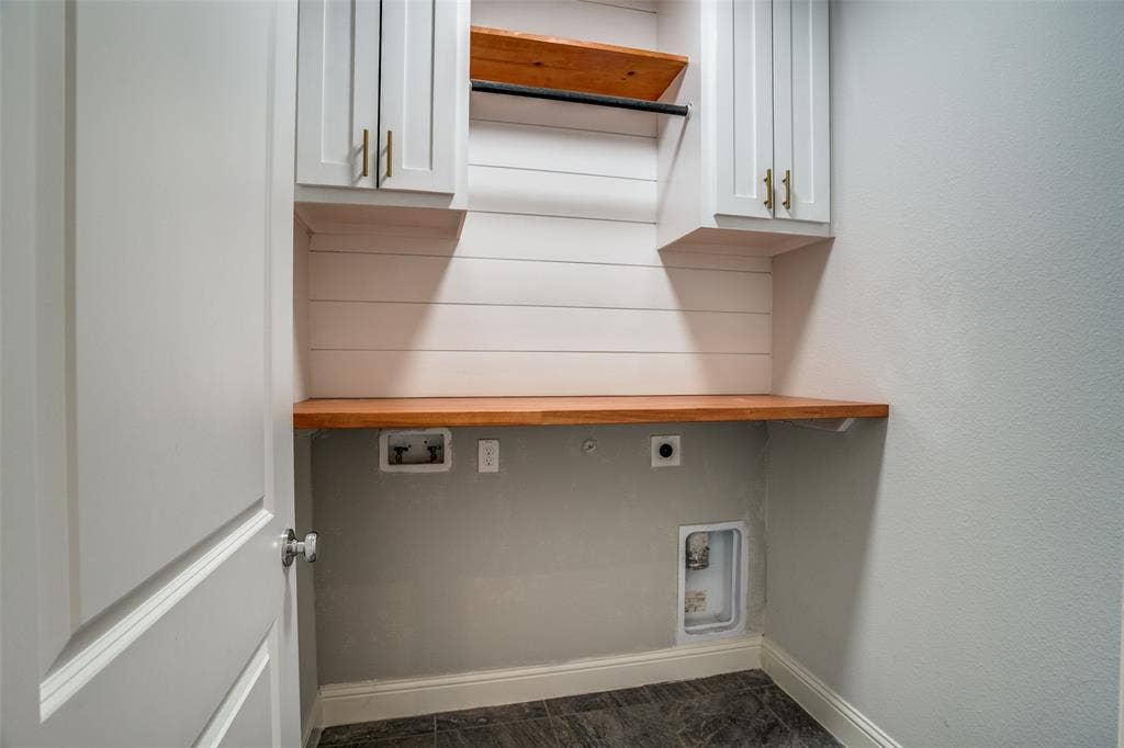 2811 Killdeer Trail, Prosper, TX 75078 Laundry area with electric dryer hookup, cabinet space, and washer hookup
