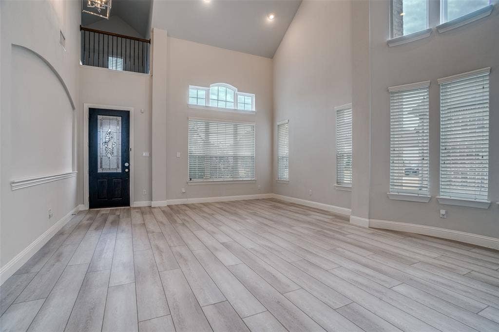 2811 Killdeer Trail, Prosper, TX 75078 Entrance foyer featuring light wood-style floors, lofted ceiling, and recessed lighting
