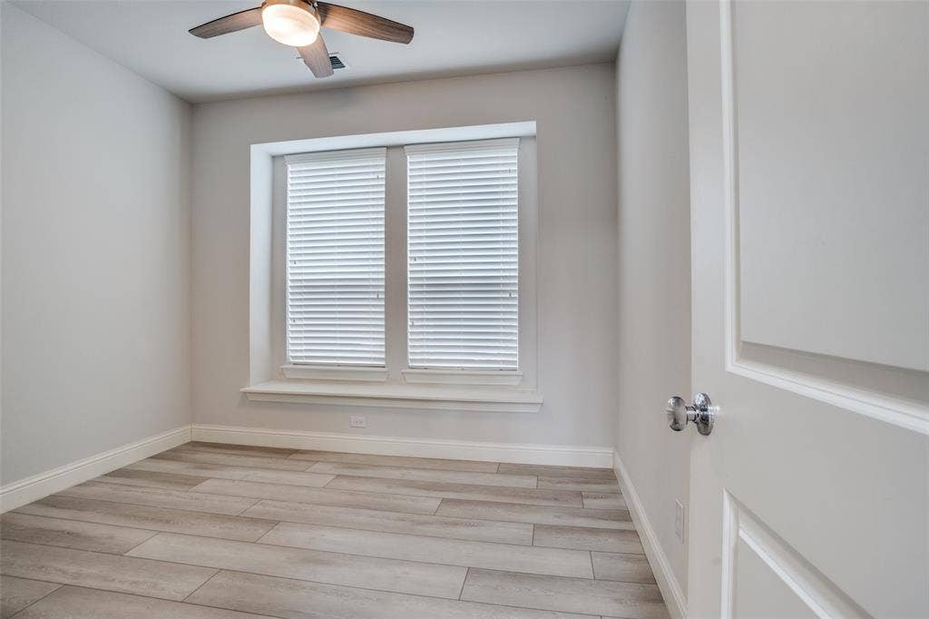 2811 Killdeer Trail, Prosper, TX 75078 Unfurnished room with light wood-style flooring and a ceiling fan