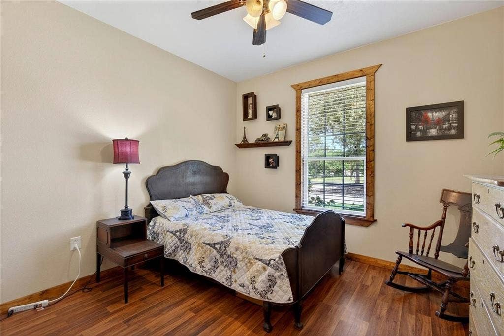 11591 Fm 59, Athens, TX 75751 3rd bedroom on Level 1 Warm-toned wood-finish flooring complements the neutral wall color