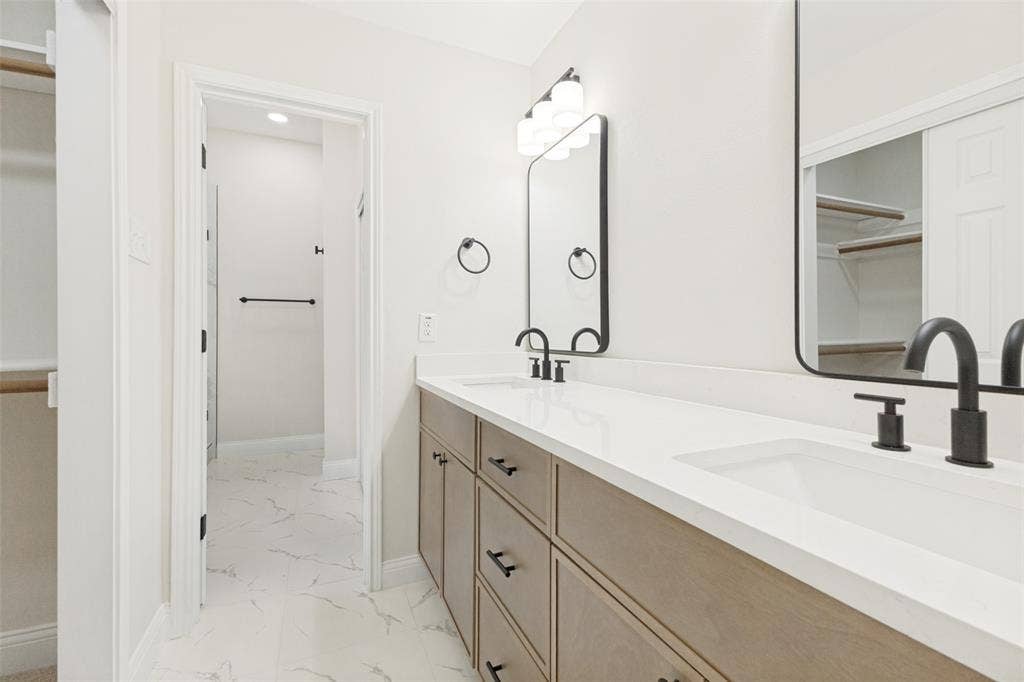 713 Bridgewater Lane, Mesquite, TX 75181 Double vanity with integrated sinks and white countertops