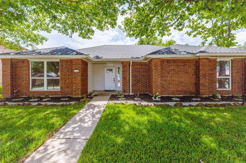 713 Bridgewater Lane, Mesquite, TX 75181 Brick facade with white trim and a contrasting dark roof