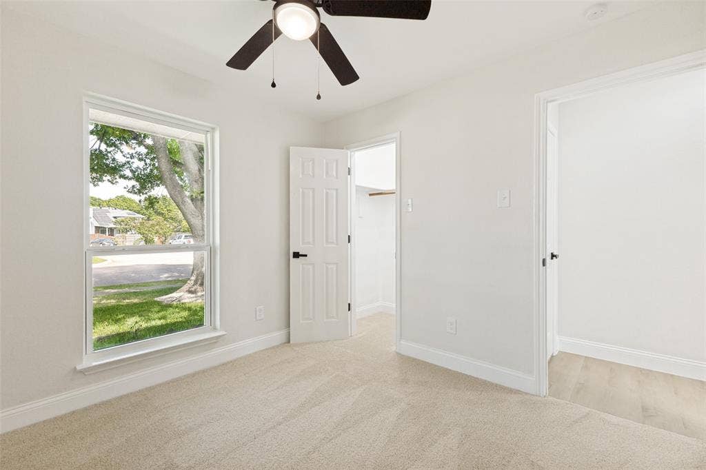 713 Bridgewater Lane, Mesquite, TX 75181 Bedroom featuring neutral-toned carpet flooring and a double-hung window