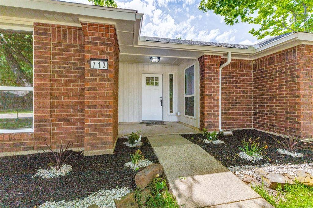 713 Bridgewater Lane, Mesquite, TX 75181 Brick exterior with white siding accents