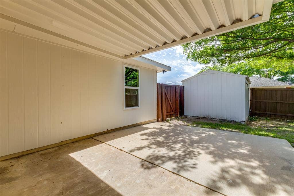 713 Bridgewater Lane, Mesquite, TX 75181 Covered concrete patio with white corrugated ceiling