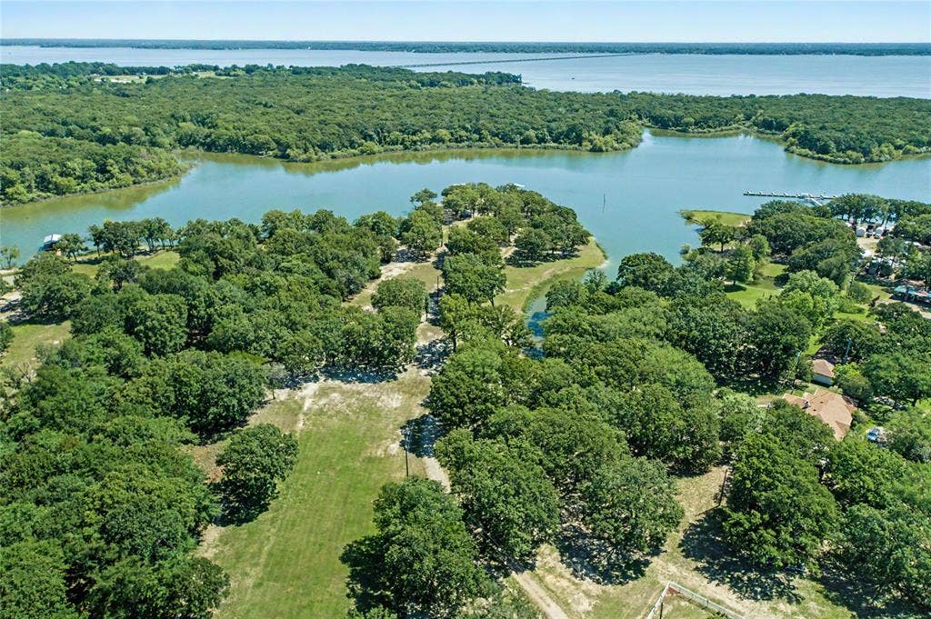 101 Friendship Circle, West Tawakoni, TX 75474 Expansive wooded property featuring mature trees and partial clearing