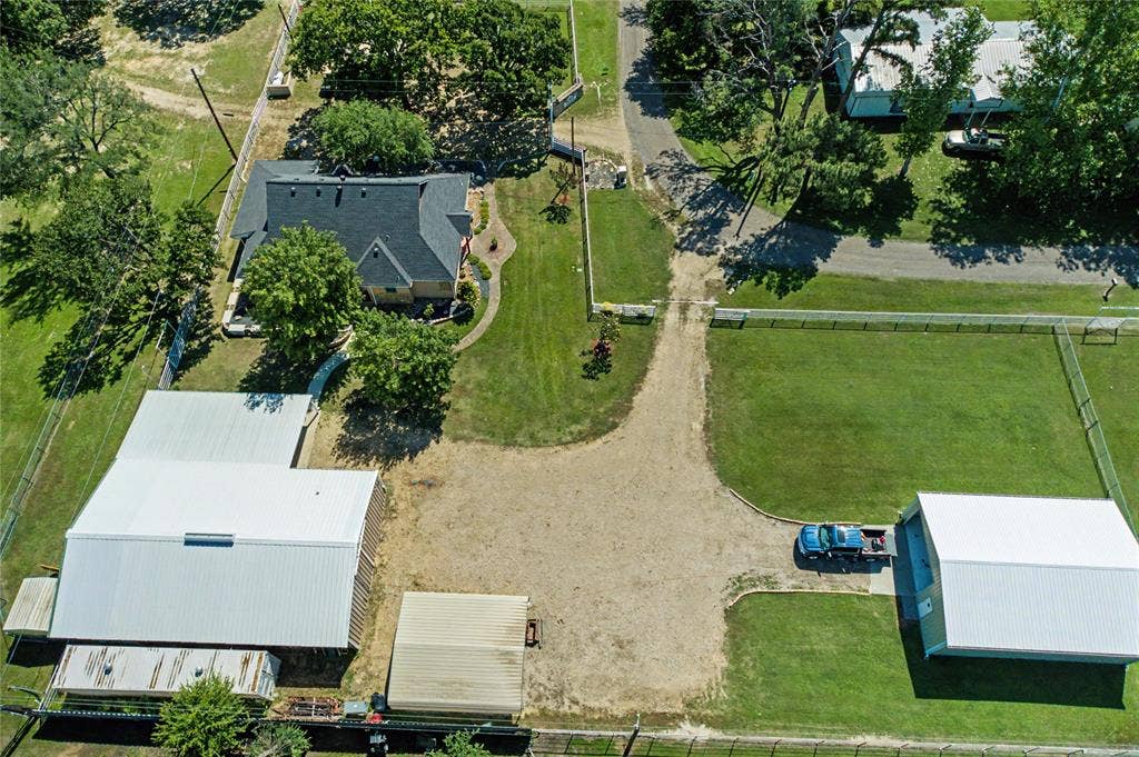 101 Friendship Circle, West Tawakoni, TX 75474 Expansive property featuring a residence, multiple outbuildings, and large open areas