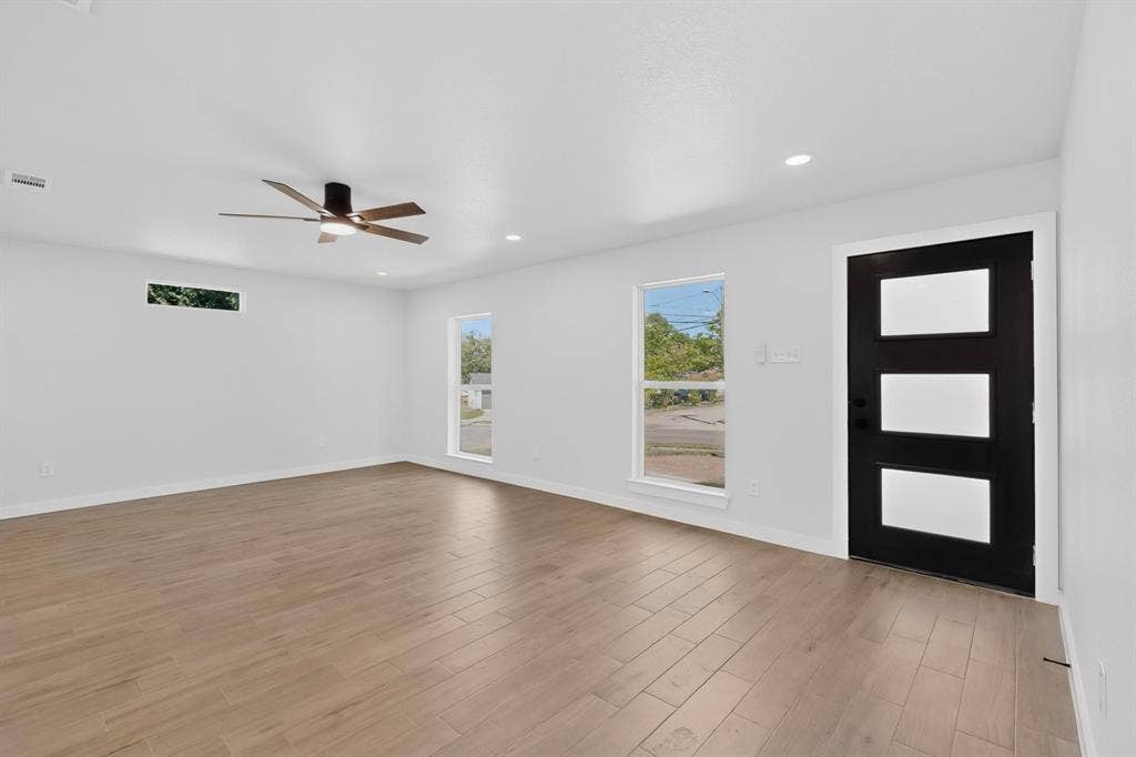 3853 Happy Canyon Drive, Dallas, TX 75241 Spacious interior with wood-finish flooring, white walls, and recessed lighting