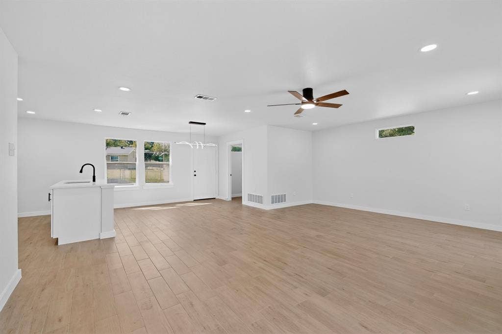 3853 Happy Canyon Drive, Dallas, TX 75241 Open-concept interior featuring wood-finish flooring, recessed lighting, and a modern ceiling fan
