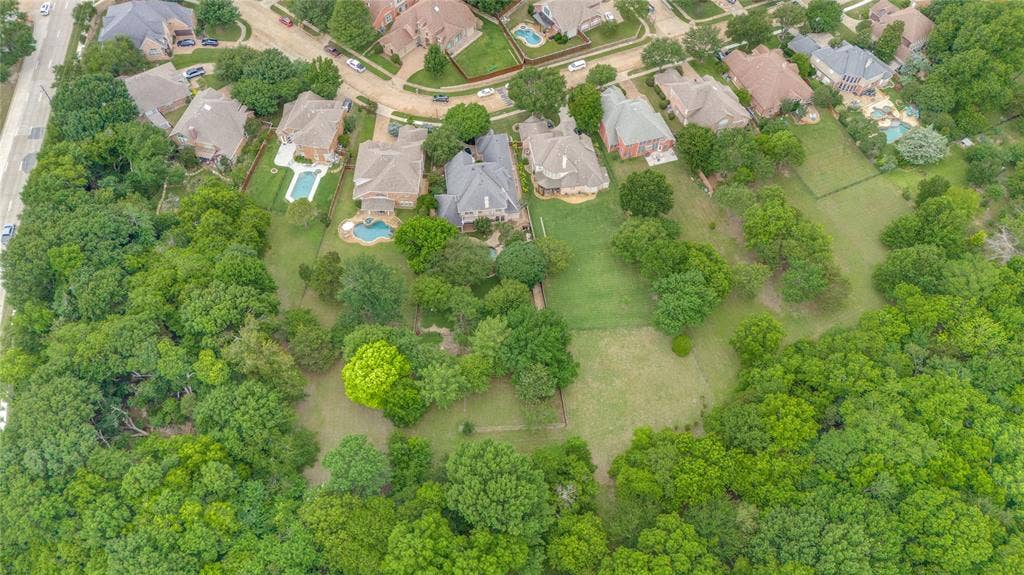 108 Appalachian Way, McKinney, TX 75071 Expansive green space featuring a grass-covered field surrounded by mature trees