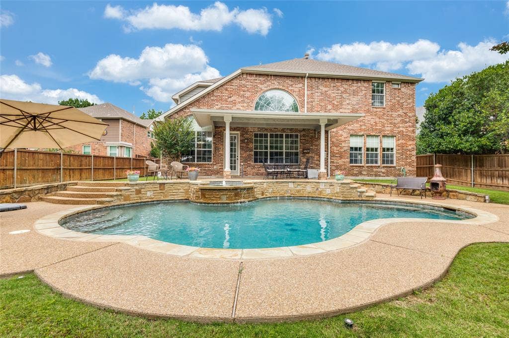 108 Appalachian Way, McKinney, TX 75071 Expansive backyard oasis featuring a freeform pool with stone coping and an integrated spa