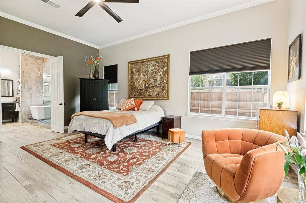 108 Appalachian Way, McKinney, TX 75071 Spacious bedroom featuring light-toned wood-finish flooring, a ceiling fan, and a large window with privacy blinds