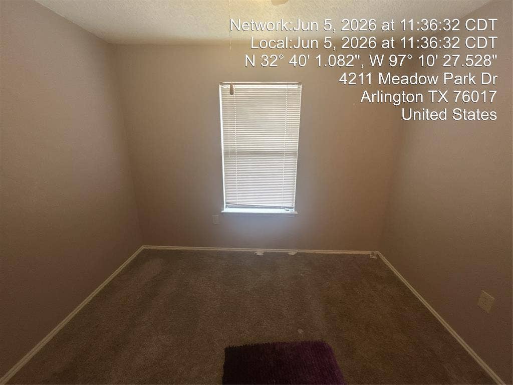 4211 Meadow Park Drive, Arlington, TX 76017 Neutral wall paint, carpet flooring, and a single window with blinds