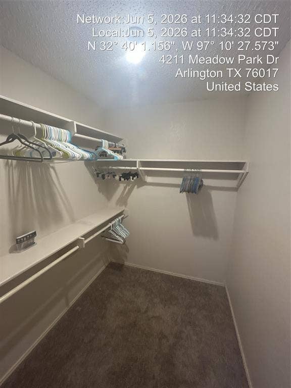 4211 Meadow Park Drive, Arlington, TX 76017 Walk-in closet featuring white walls, carpeted flooring, and built-in white shelving with hanging rods