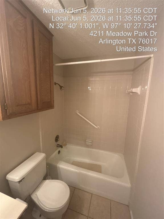 4211 Meadow Park Drive, Arlington, TX 76017 Bathroom featuring a white tub, shower with a curved shower rod, tile surround, and a grab bar