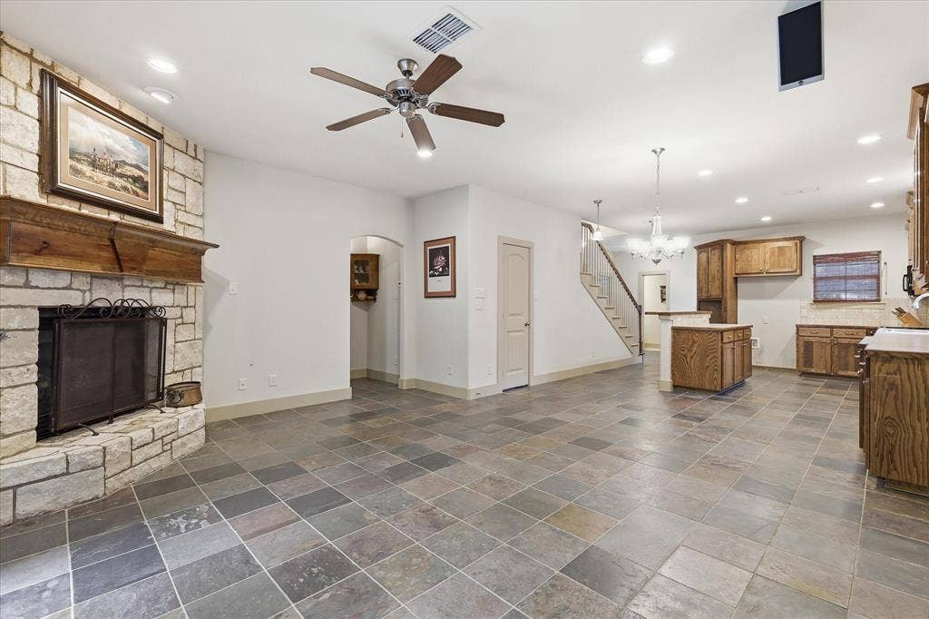 413 Collins Street, Argyle, TX 76226 Spacious open-concept interior featuring varied-sized slate tile flooring throughout