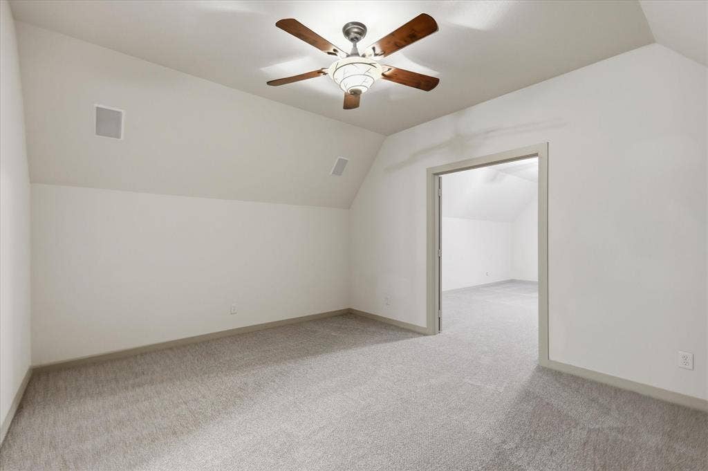 413 Collins Street, Argyle, TX 76226 Carpeted room featuring a sloped ceiling and an overhead ceiling fan with integrated lighting
