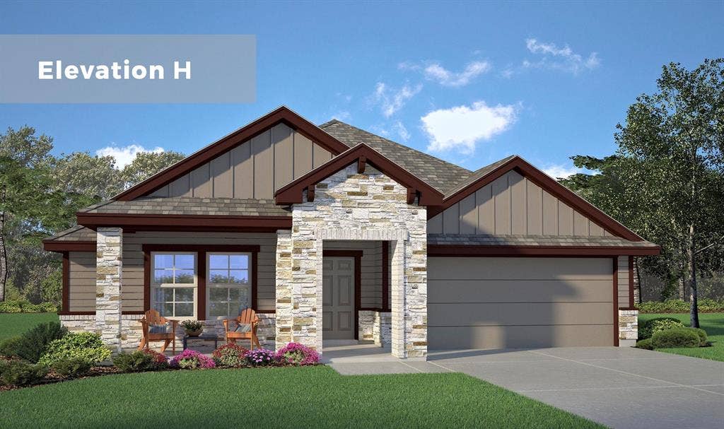 Single-story residence featuring a stone and siding exterior, front-facing two-car garage, and a covered front porch