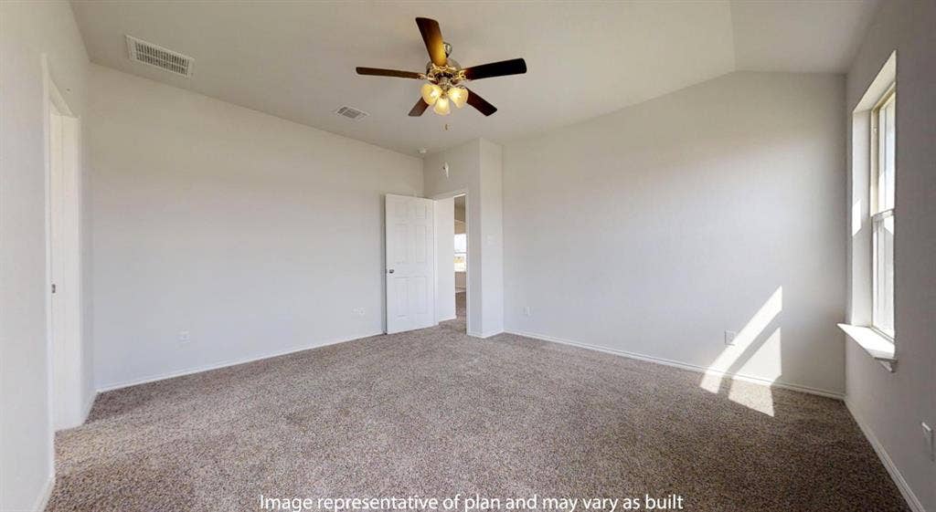 Carpeted room featuring a vaulted ceiling with a ceiling fan light fixture, white walls, and a window with a white sill