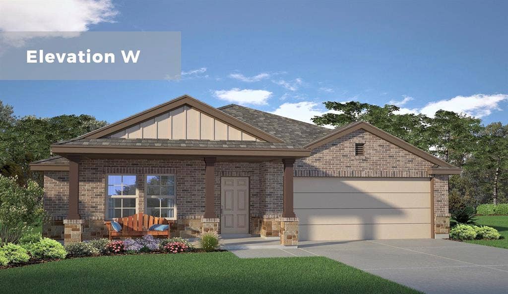 Brick exterior with stone accents, a covered entry, and an attached two-car garage