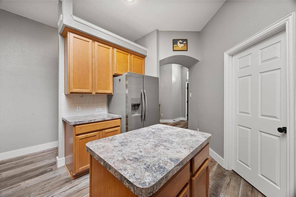 range and walk-in The door leads into the large pantry with laundry connections.