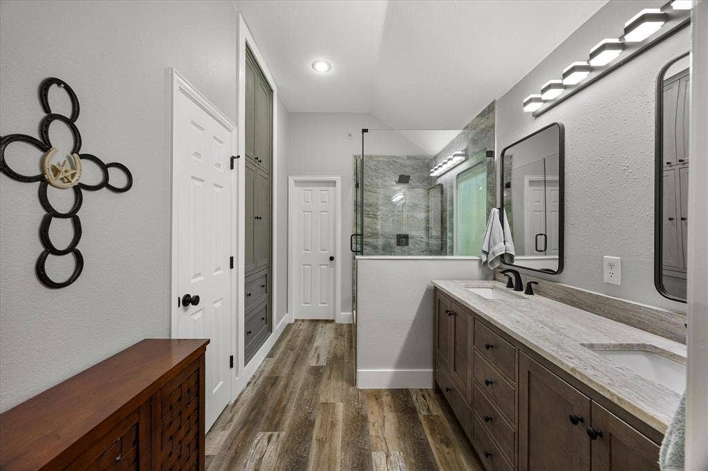 There's also a large walk-in closet and custom built-in linen cabinet with drawers.
