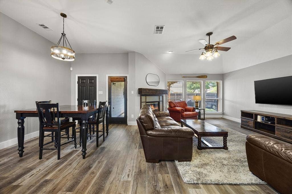 The family room's wall of windows overlooks the covered patio and backyard.