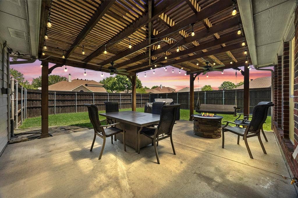The backyard is ready for outdoor entertaining with its huge pergola covered patio with string lights, ceiling fan and gas stub for your grill.