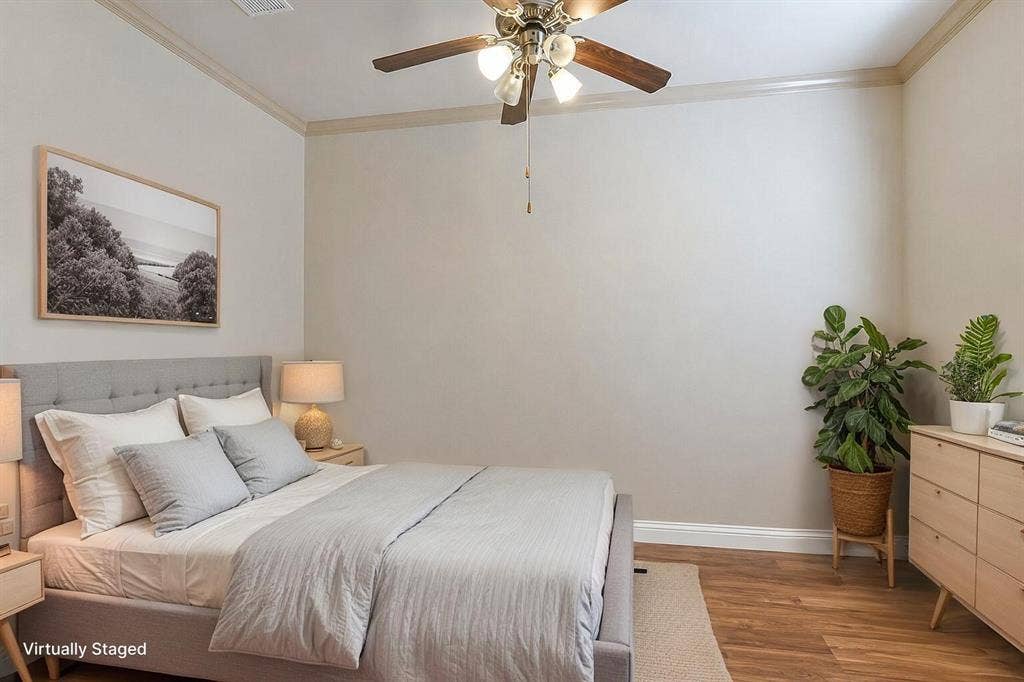 2705 Fox Creek Trail, Arlington, TX 76017 Spacious room featuring wood-finish flooring, crown molding, and a ceiling fan with integrated lighting