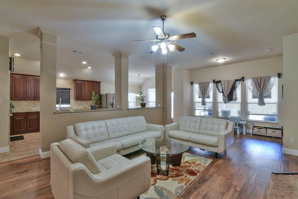 2705 Fox Creek Trail, Arlington, TX 76017 Expansive living area with wood-finish flooring, recessed lighting, and a ceiling fan