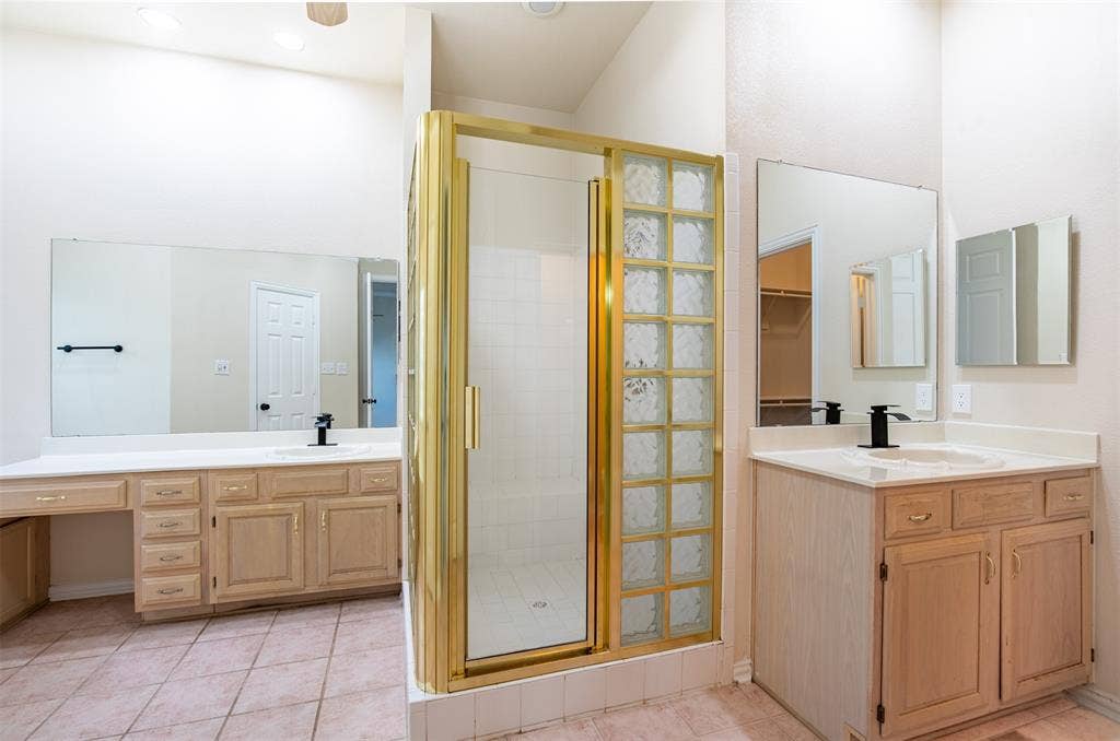 1405 Faringdon Drive, Plano, TX 75075 En-suite bath features dual vanities with sitting area, and framed shower.