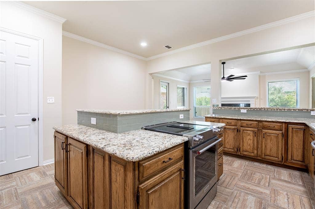 1405 Faringdon Drive, Plano, TX 75075 Kitchen with large island with bar top and walk-in pantry.