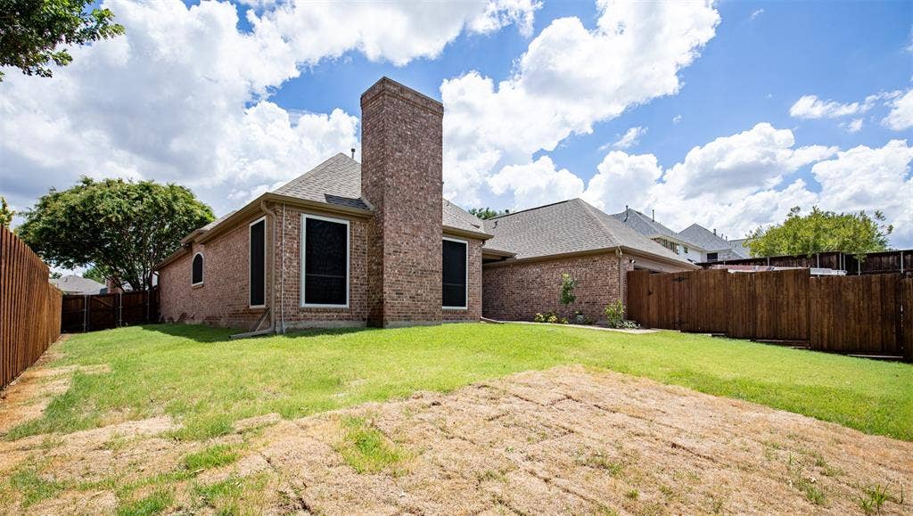 1405 Faringdon Drive, Plano, TX 75075 Backyard surrounded by privacy fencing.