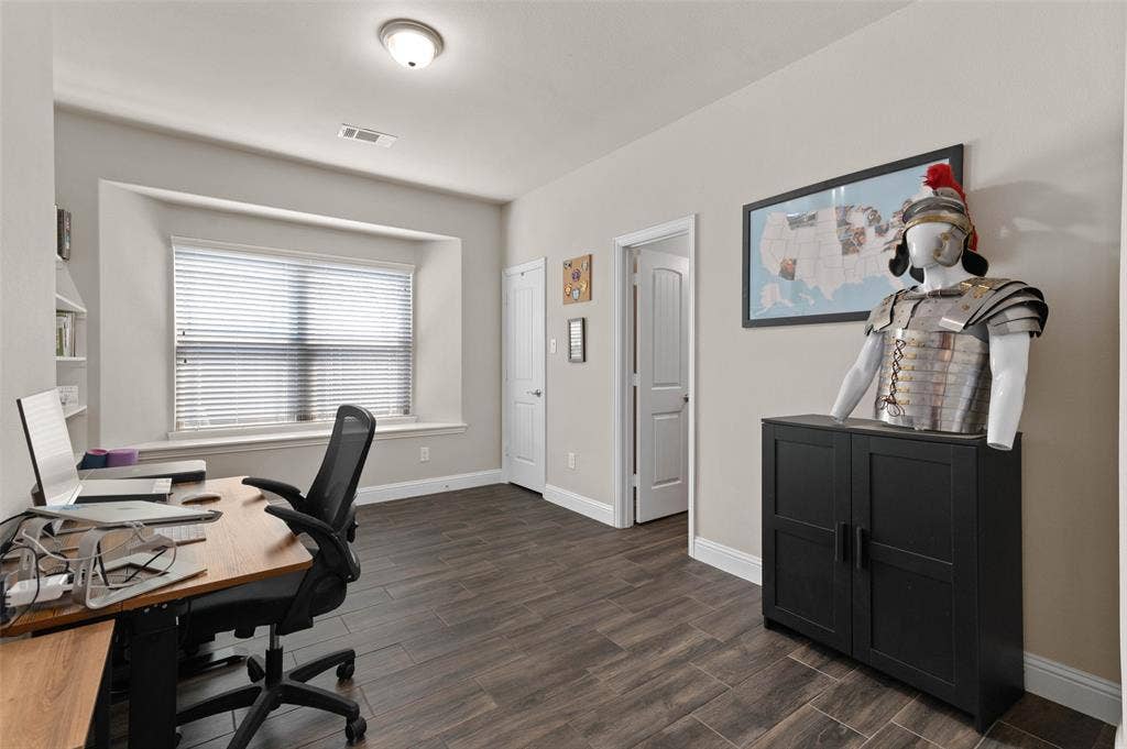 800 Beckington Drive, Shady Shores, TX 76208 Bedroom used as an office! This room featuring wood-finish flooring, a recessed window, and white trim