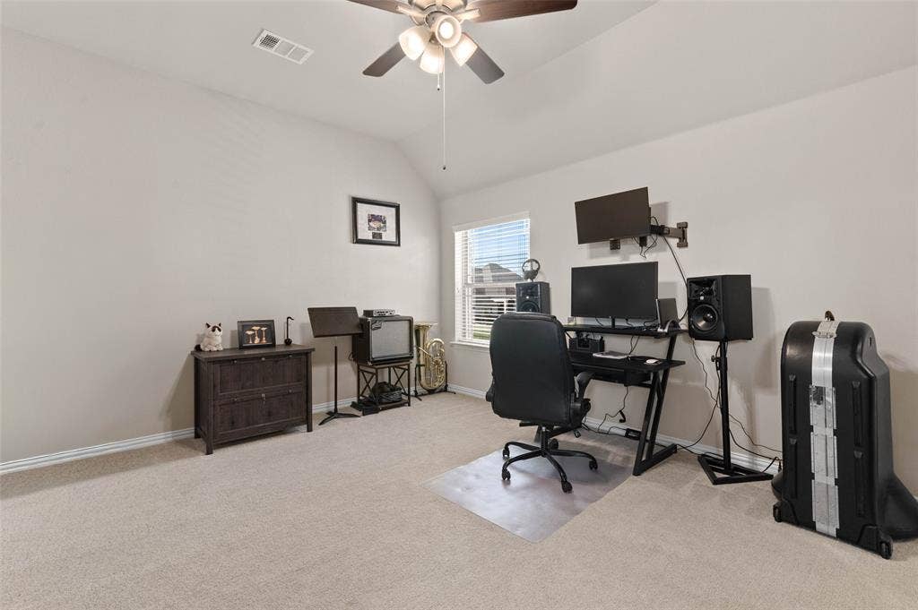 800 Beckington Drive, Shady Shores, TX 76208 Spacious Secondary Bedroom room featuring vaulted ceilings, neutral wall paint, and light-toned carpet flooring