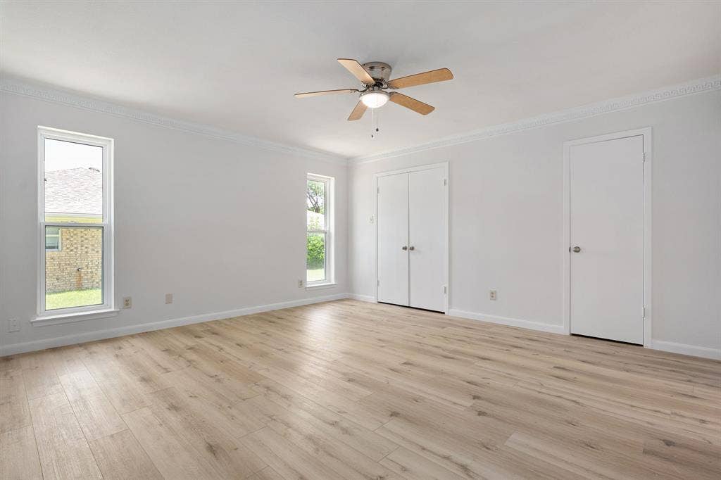 3406 Windridge Drive, Garland, TX 75043 Light wood-finish flooring complements the bright interior