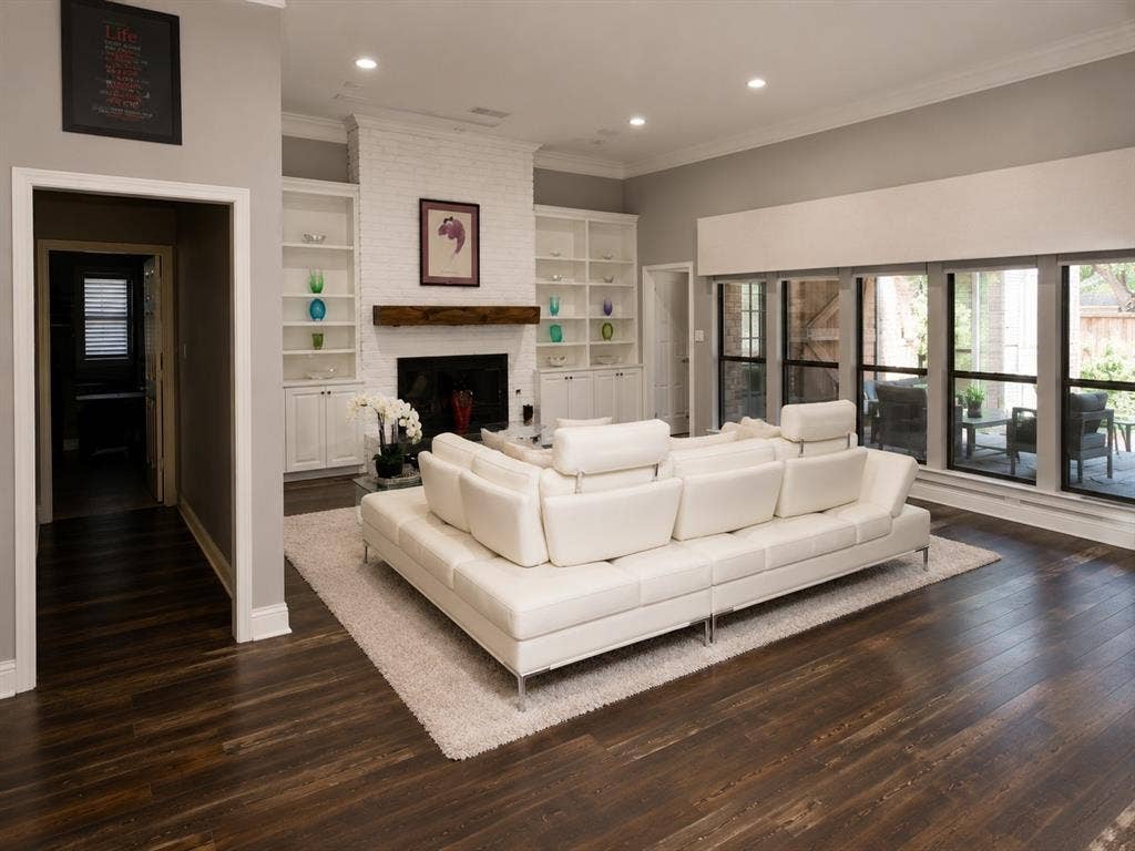 4315 Creekmeadow Drive, Dallas, TX 75287 Build-in shelving frames fireplace. Large Windows overlook patio and pool