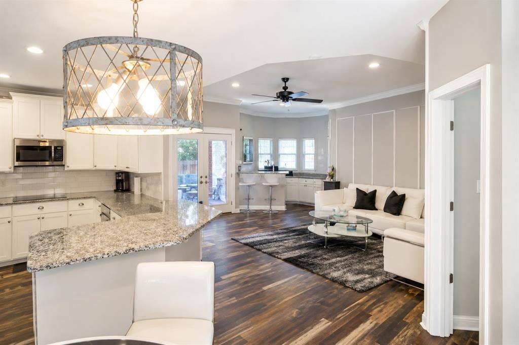4315 Creekmeadow Drive, Dallas, TX 75287 Kitchen and den open to the breakfast area and pool.