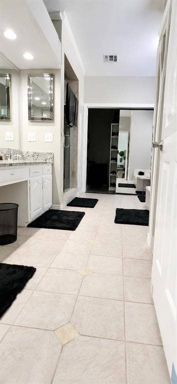 4315 Creekmeadow Drive, Dallas, TX 75287 Large bath with custom his and hers closet, abundant storage!