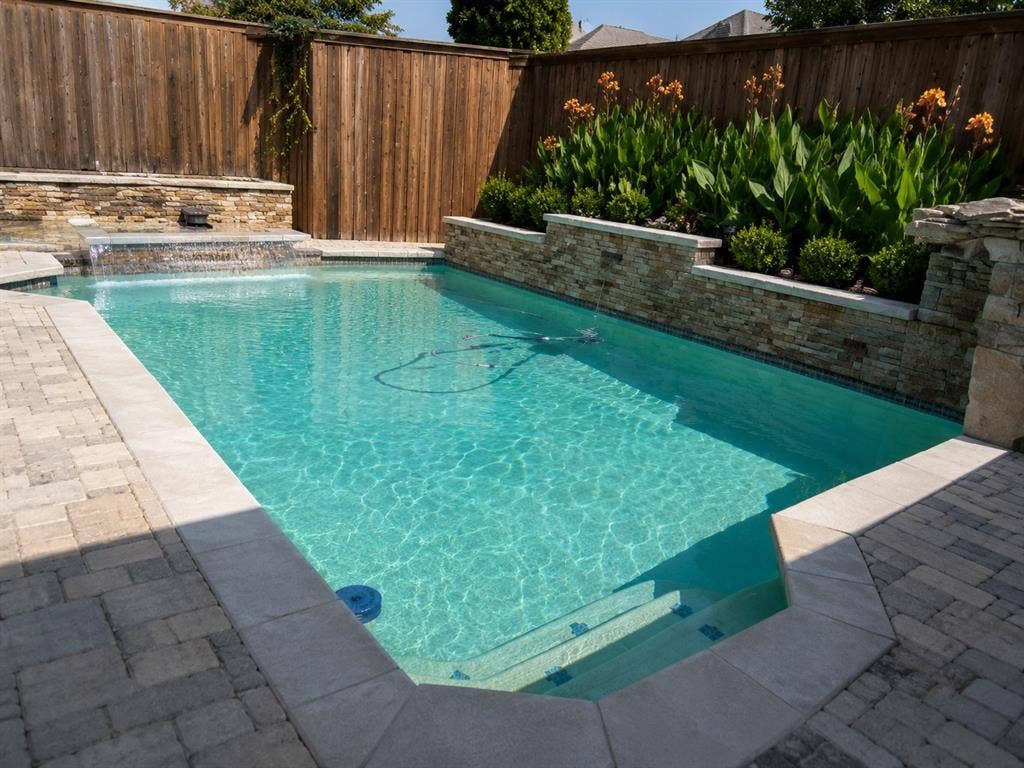 4315 Creekmeadow Drive, Dallas, TX 75287 Low maintenance plants surround the pool area. the fountain makes this a sound and visual paradise!