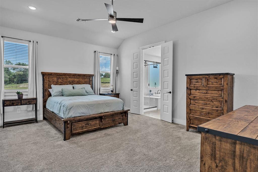 2004 Willy Dilly Road, Springtown, TX 76082 Spacious open-concept living area featuring a vaulted ceiling and light wood-finish flooring