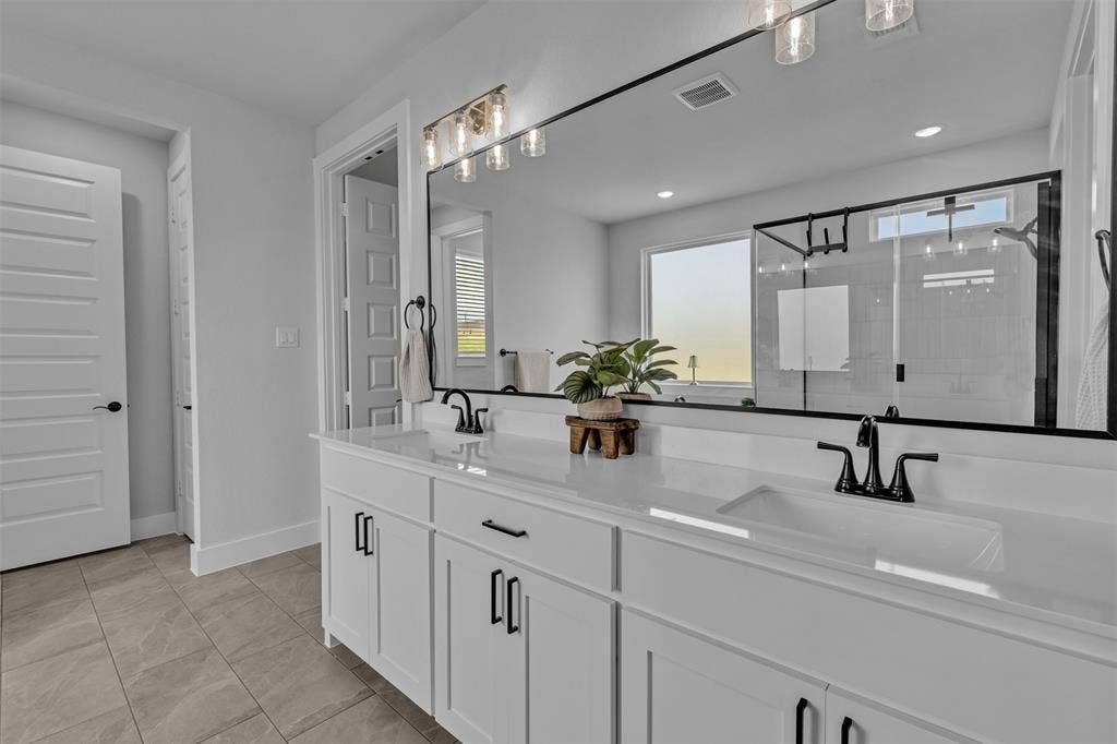 2004 Willy Dilly Road, Springtown, TX 76082 Dual vanity with integrated sinks, white cabinetry, and matte black hardware