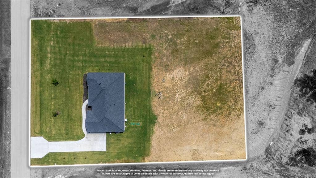 2004 Willy Dilly Road, Springtown, TX 76082 Aerial view showcasing a detached property with a dark shingle roof and a concrete driveway