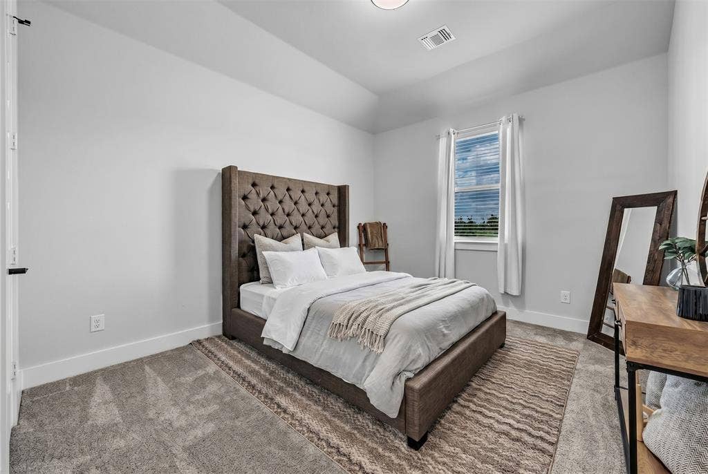 2004 Willy Dilly Road, Springtown, TX 76082 Room featuring carpet flooring, crisp white walls, a multi-paneled door with black hardware, and a window with blinds providing natural illumination