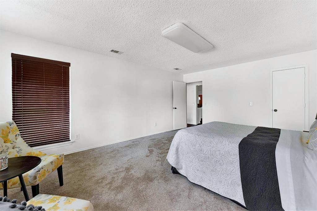 1908 Edgewater Drive, Plano, TX 75075 2nd Primary suite/ guest wing separate from other bedroom. With private bathroom.