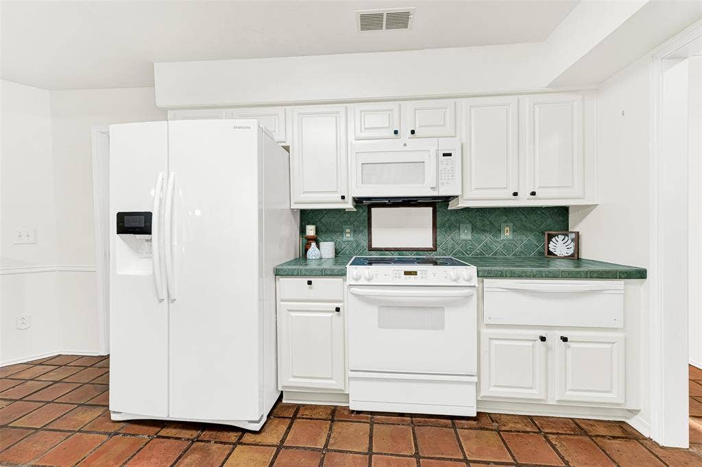 1908 Edgewater Drive, Plano, TX 75075 Great work spaces throughout the kitchen