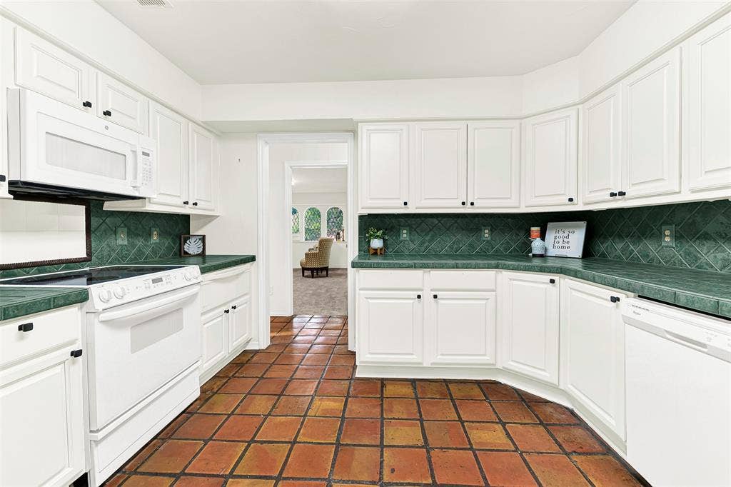 1908 Edgewater Drive, Plano, TX 75075 Easy access to play room, Dining room third bathroom. Durable Spanish tile floors