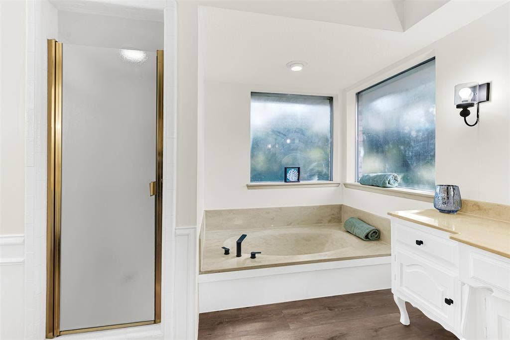 1908 Edgewater Drive, Plano, TX 75075 Updated primary bathroom, with bathroom friendly flooring just installed.